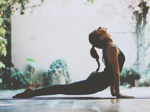 Woman stretching her back